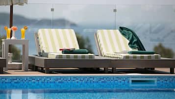 Outdoor pool, open 8:00 AM to 7:00 PM, pool umbrellas, sun loungers
