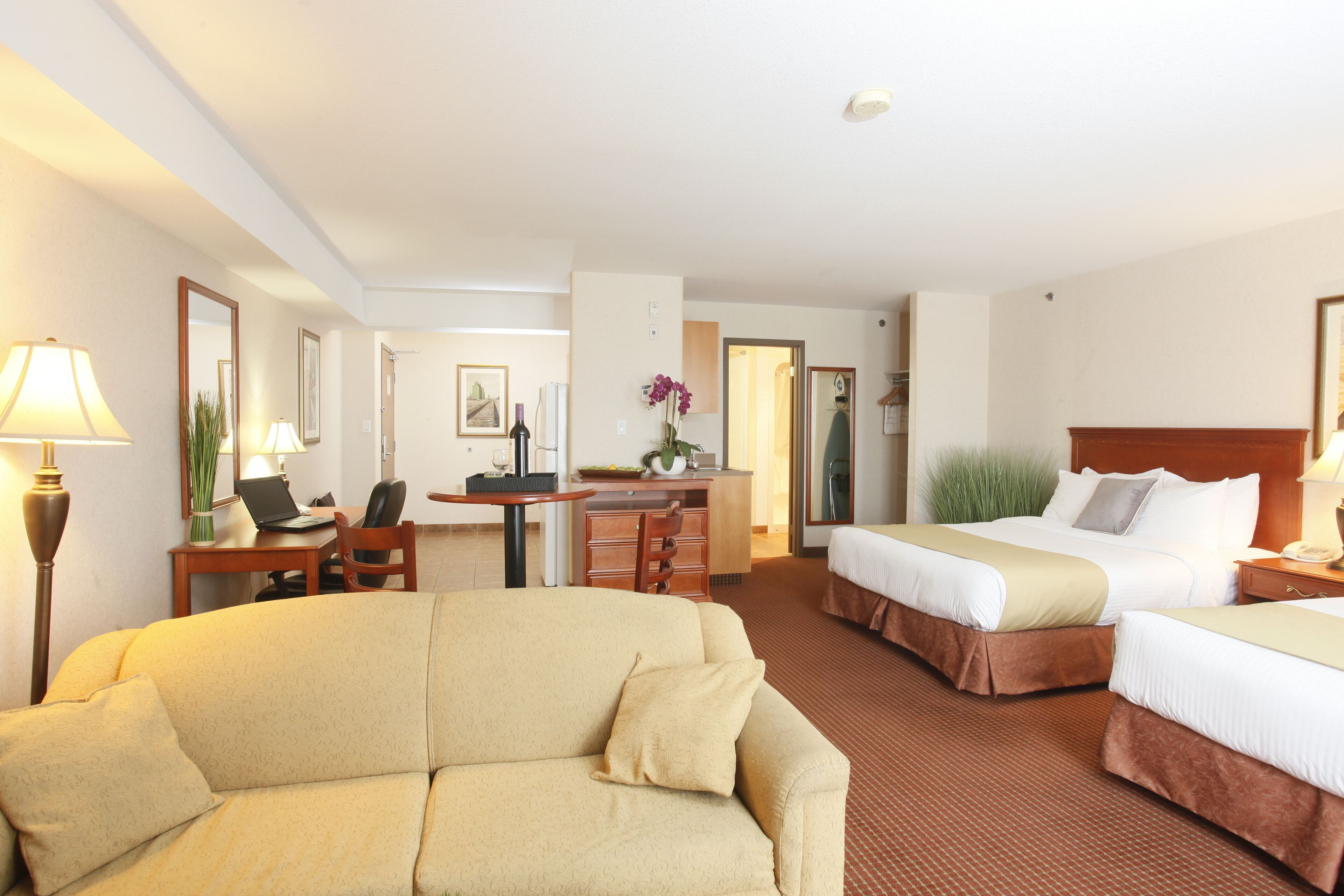 Premium bedding, desk, laptop workspace, blackout drapes