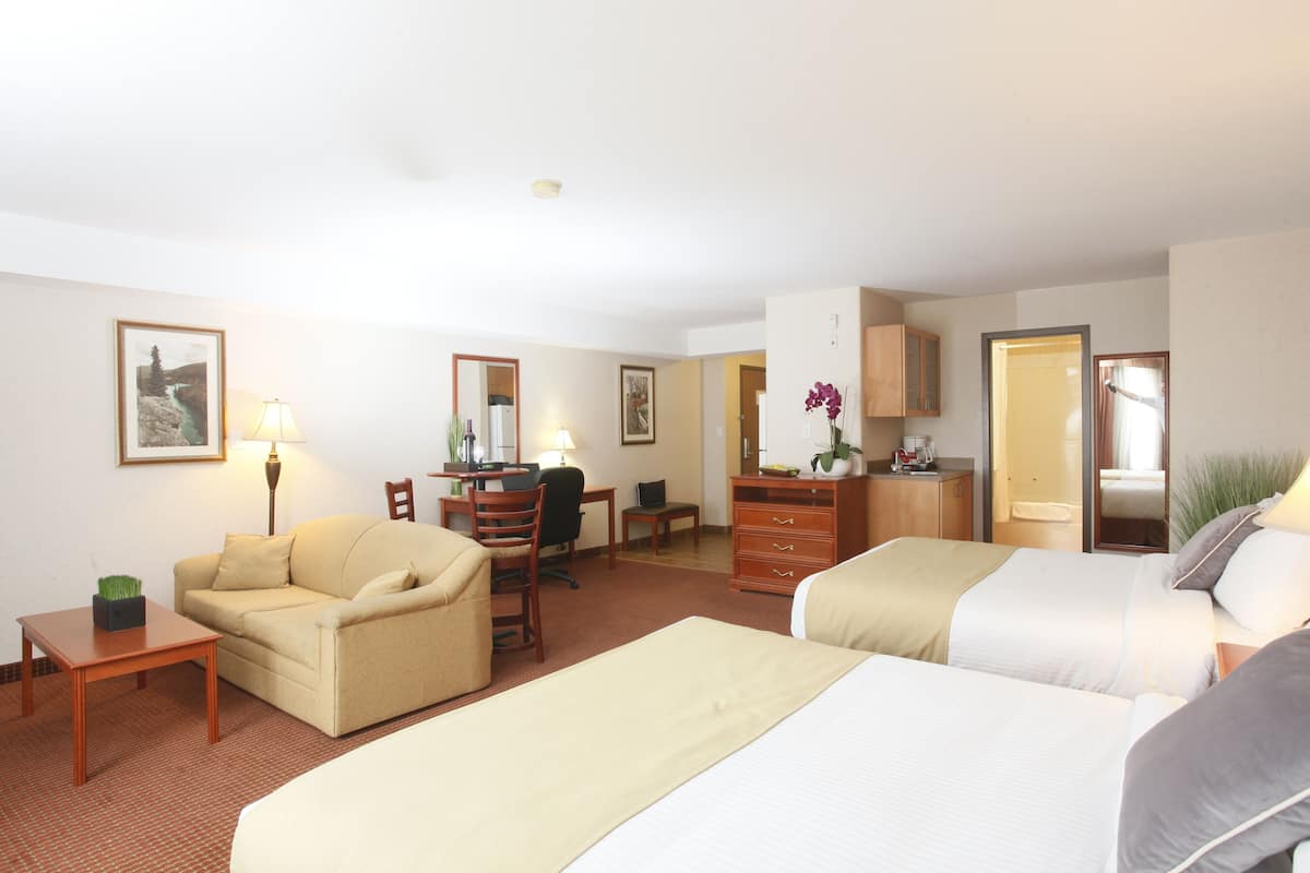 deluxe double room, multiple beds, kitchen | premium bedding, desk, laptop workspace, blackout curtains