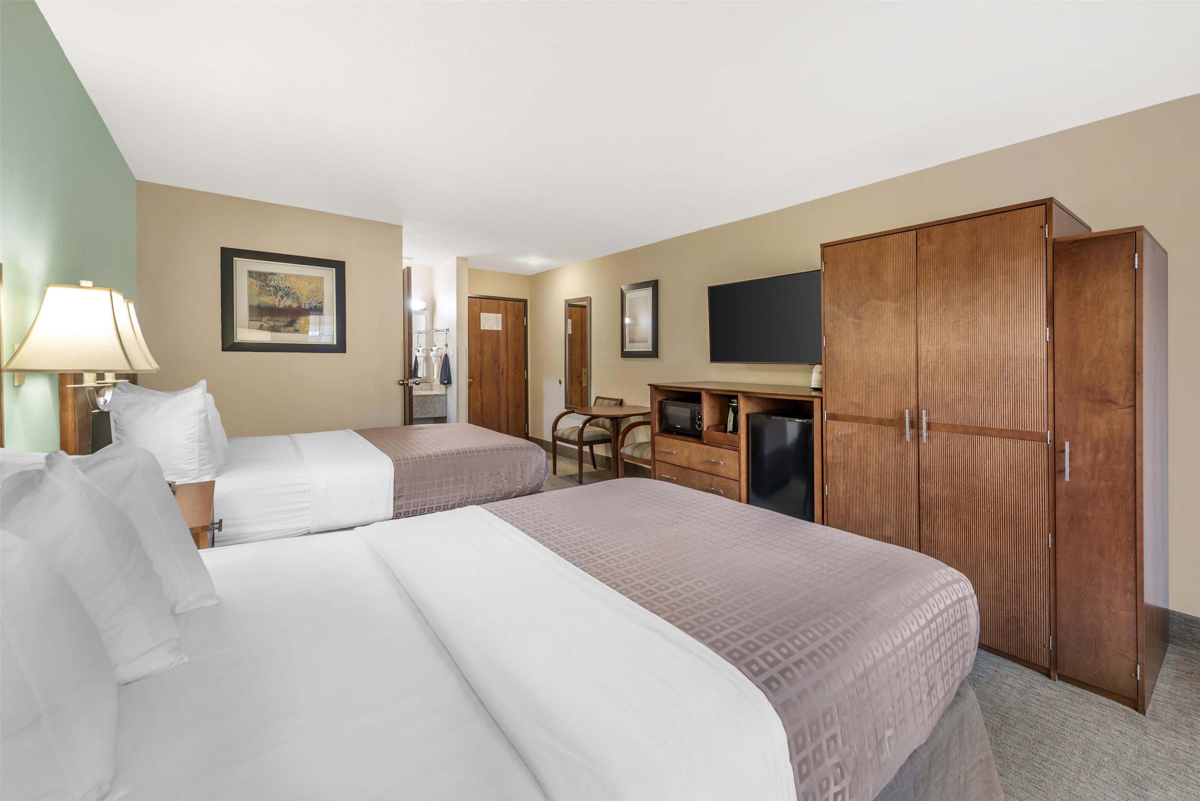 standard room, 2 queen beds, refrigerator & microwave, pool view | 1 bedroom, pillow-top beds, desk, laptop workspace