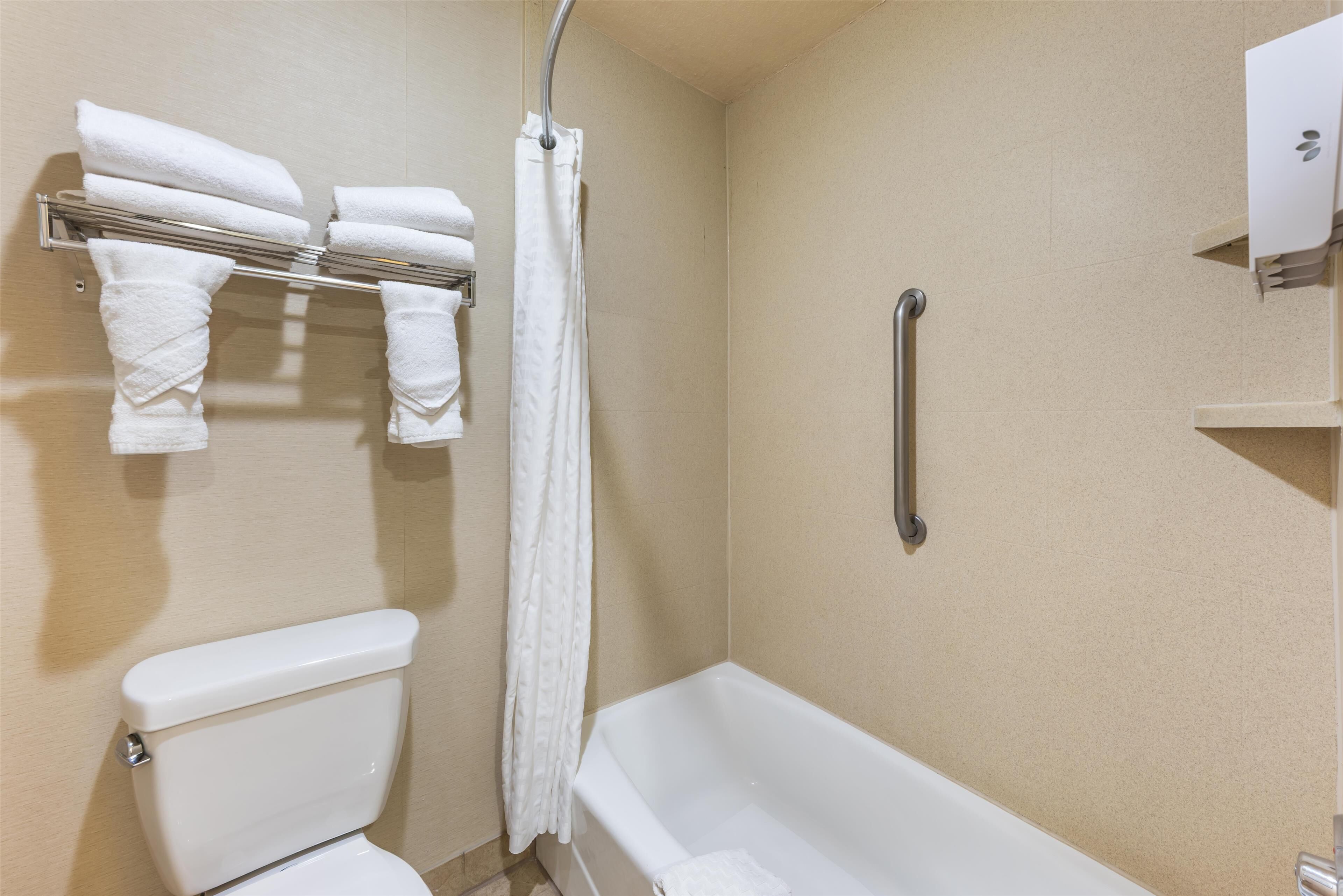 standard room, 2 queen beds, non smoking, refrigerator & microwave | bathroom | combined shower/bathtub, free toiletries, hair dryer, towels