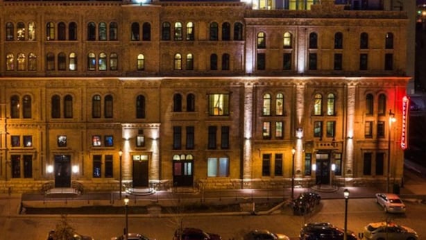 A historic building with a prominent sign for 'The Brewery' at the top. - The Brewhouse Inn & Suites (Milwaukee)