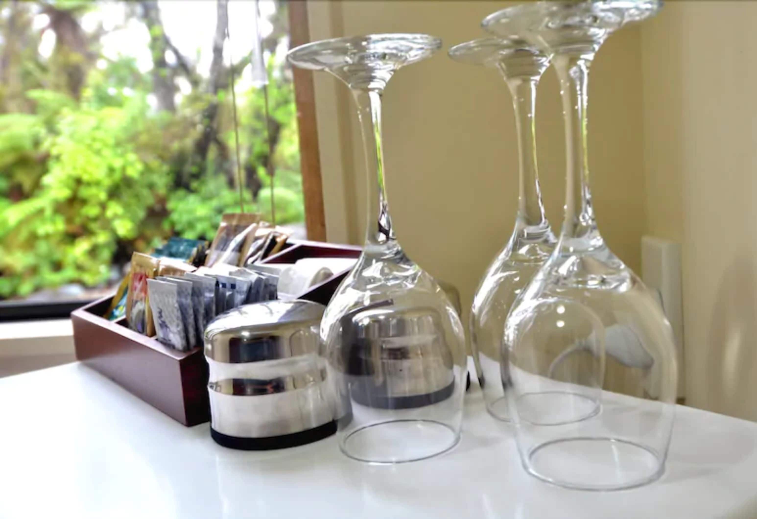 A table with wine glasses and a candle holder.