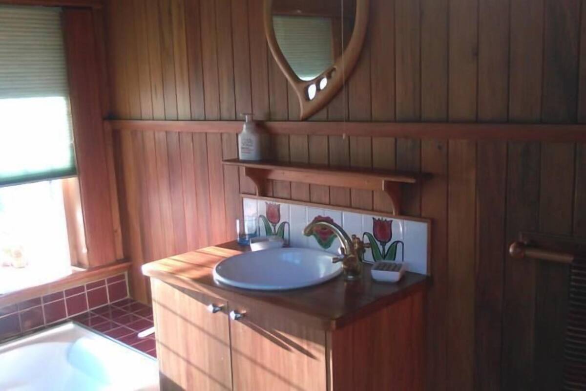 the den - shared bathroom | bathroom | eco-friendly toiletries, towels