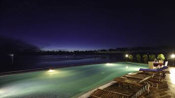 Outdoor pool, an infinity pool, sun loungers