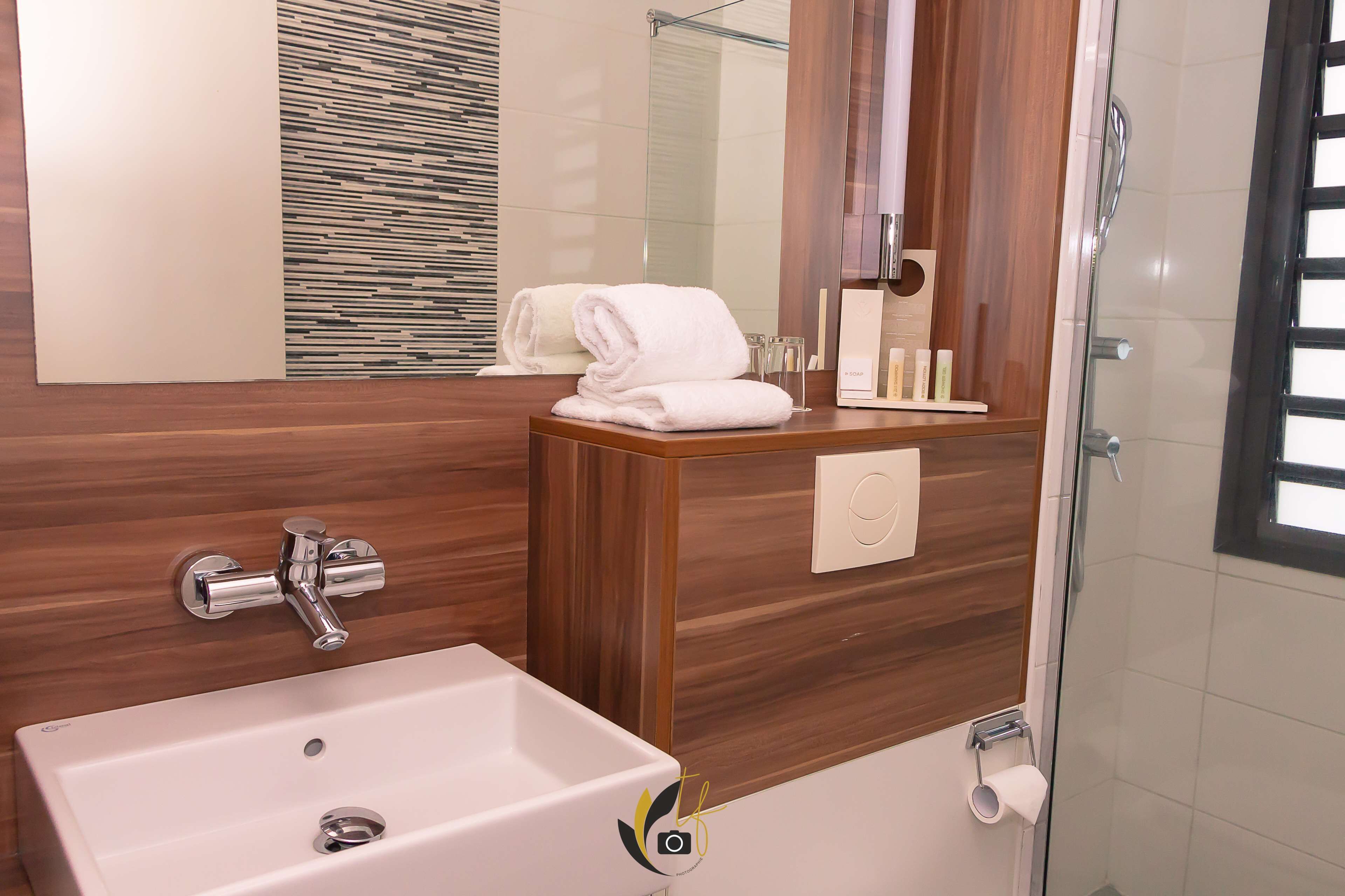 eco-friendly toiletries, hair dryer, towels