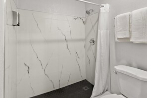 Designer toiletries, towels, soap, shampoo