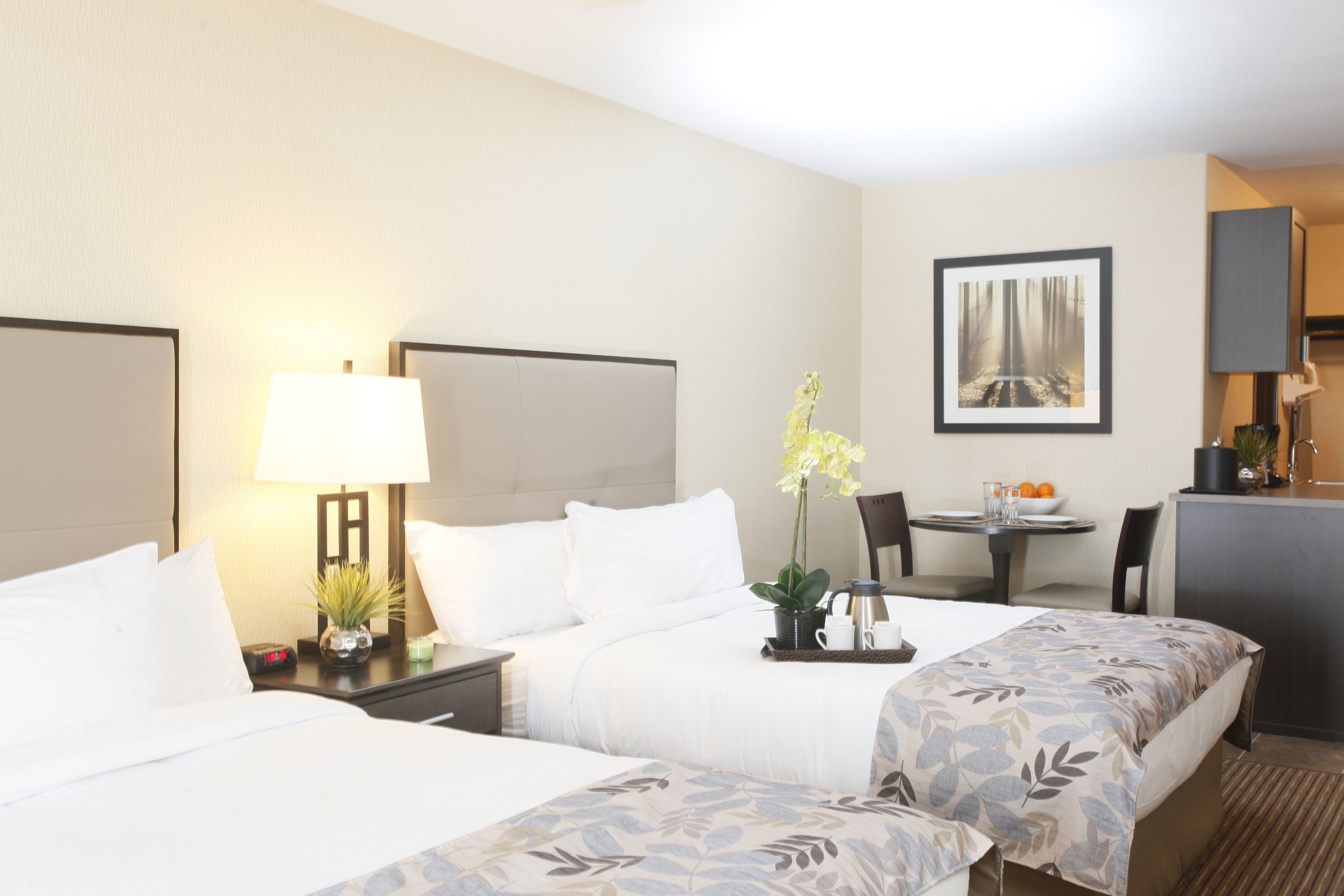 deluxe double room, 2 queen beds, kitchen | premium bedding, pillow-top beds, desk, laptop workspace