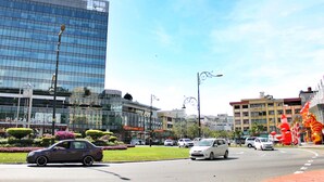 A modern urban street with cars, buildings, and decorative elements. - Lavender Lodge (Kota Kinabalu)