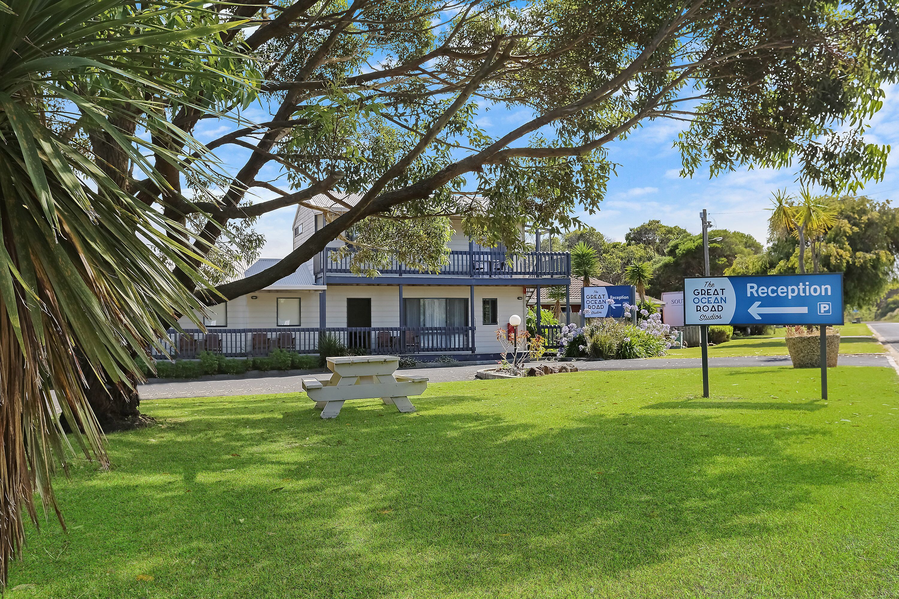 A reception area with a sign indicating a parking area.