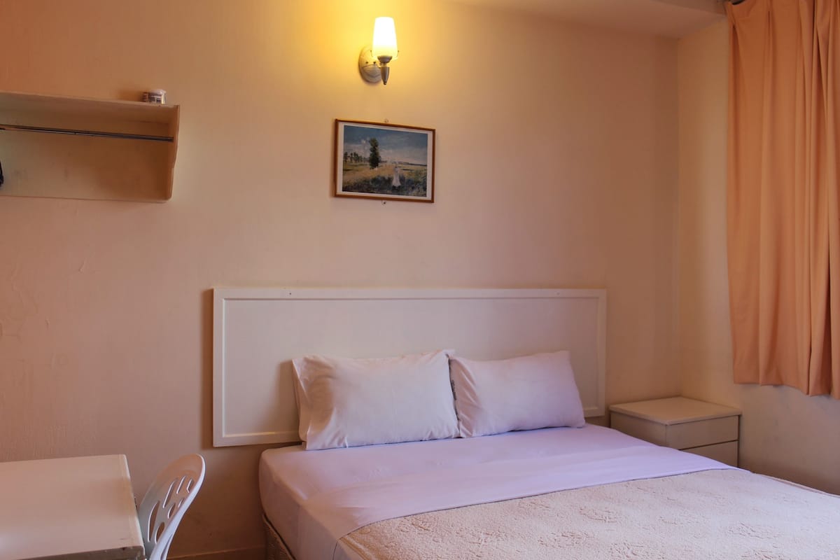 Deluxe Room | In-room safe, blackout curtains, soundproofing, iron/ironing board