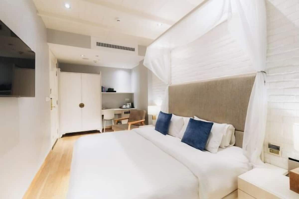 1 dormitorio, edredones de plumas, minibar con artículos gratuitos