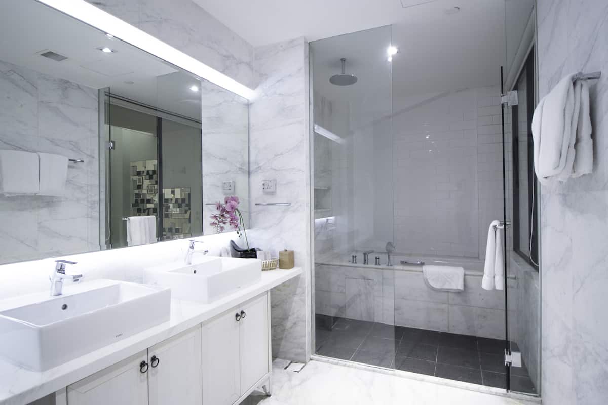 family suite, multiple beds | bathroom | free toiletries, hair dryer, slippers, towels