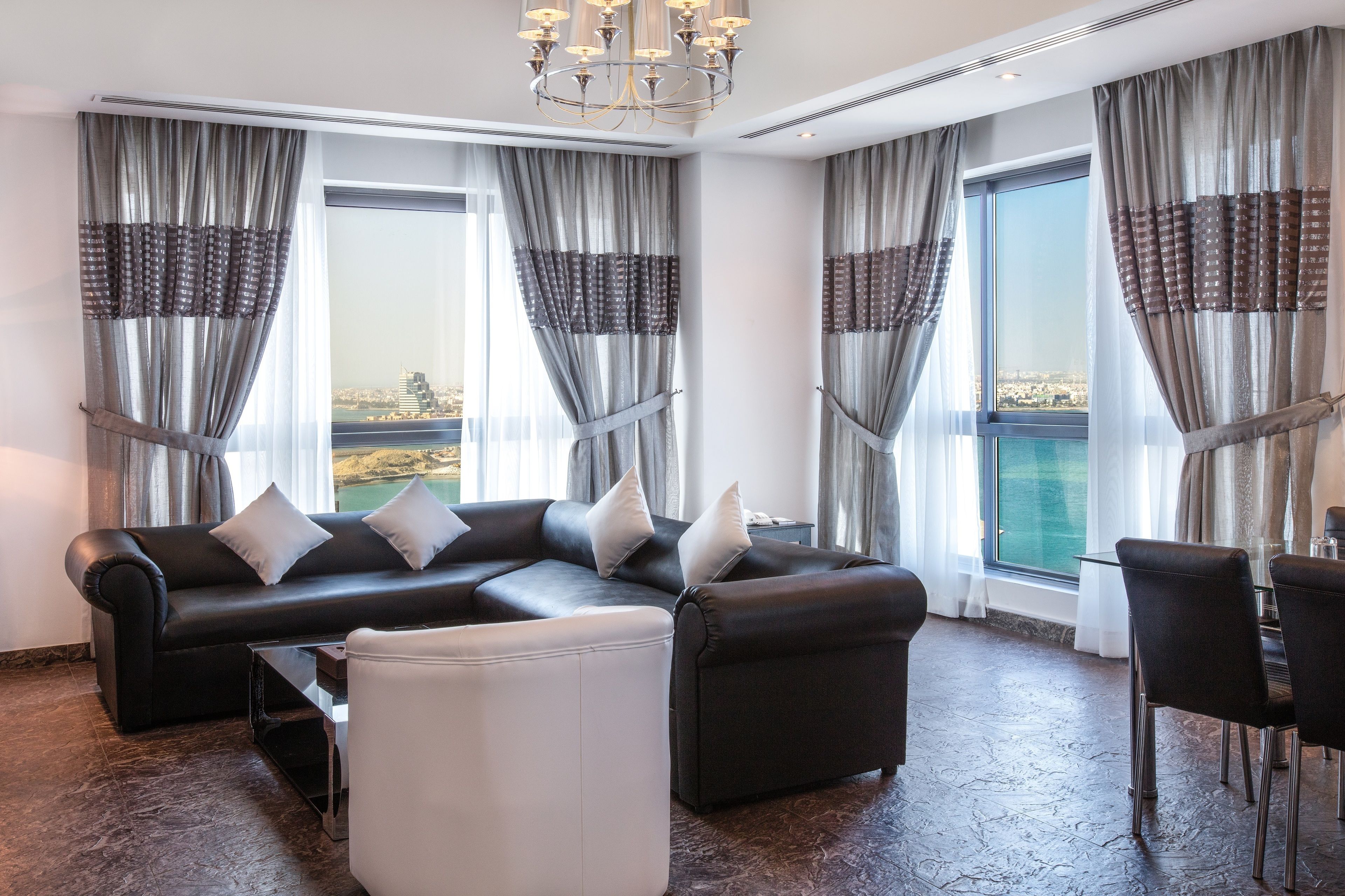 Loumage Suite | Living area | 32-inch LCD TV with satellite channels, TV