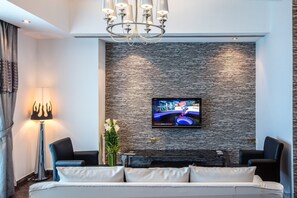 Standard Room, 1 King Bed | Living area | 32-inch LCD TV with satellite channels, TV - Loumage Hotel & Suites (Manama)
