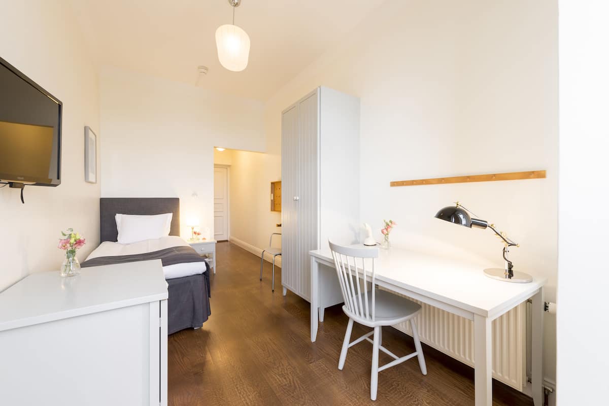Camera singola | Biancheria da letto ipoallergenica, minibar, una cassaforte in camera