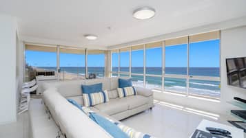 Three Bedroom Beachfront Premium Apartment | Living area | TV, DVD player