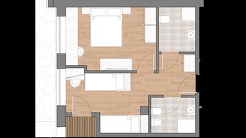 A floor plan of a hotel room with a bed, a desk, a chair, a small table, a sofa, and a bathroom.
