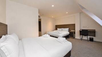 Standard Quad Room | In-room safe, desk, blackout curtains, iron/ironing board