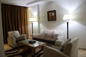 Junior Suite (without Jacuzzi) | Living room | Flat-screen TV