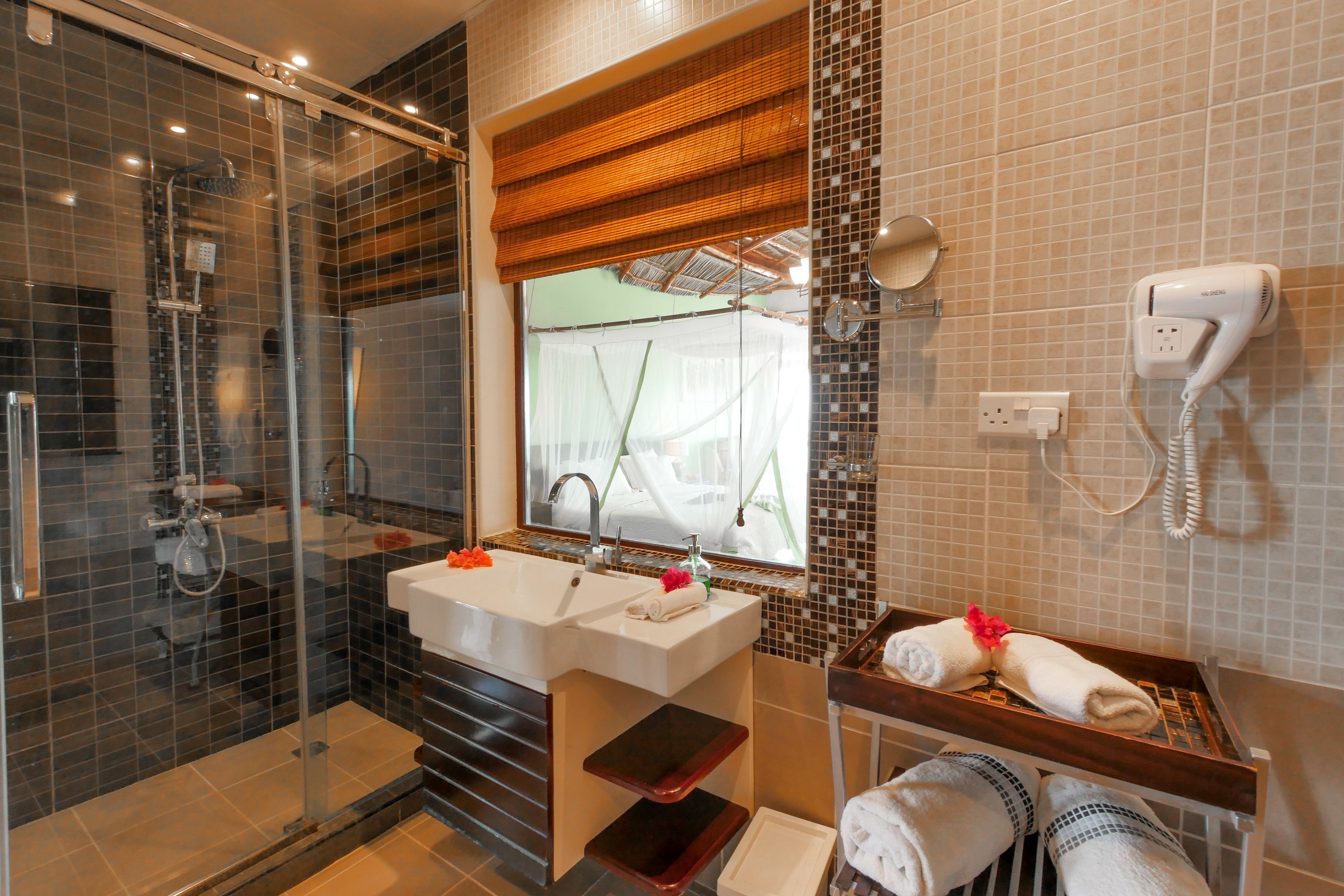 deluxe family suite ocean view  | bathroom | shower, rainfall showerhead, free toiletries, hair dryer