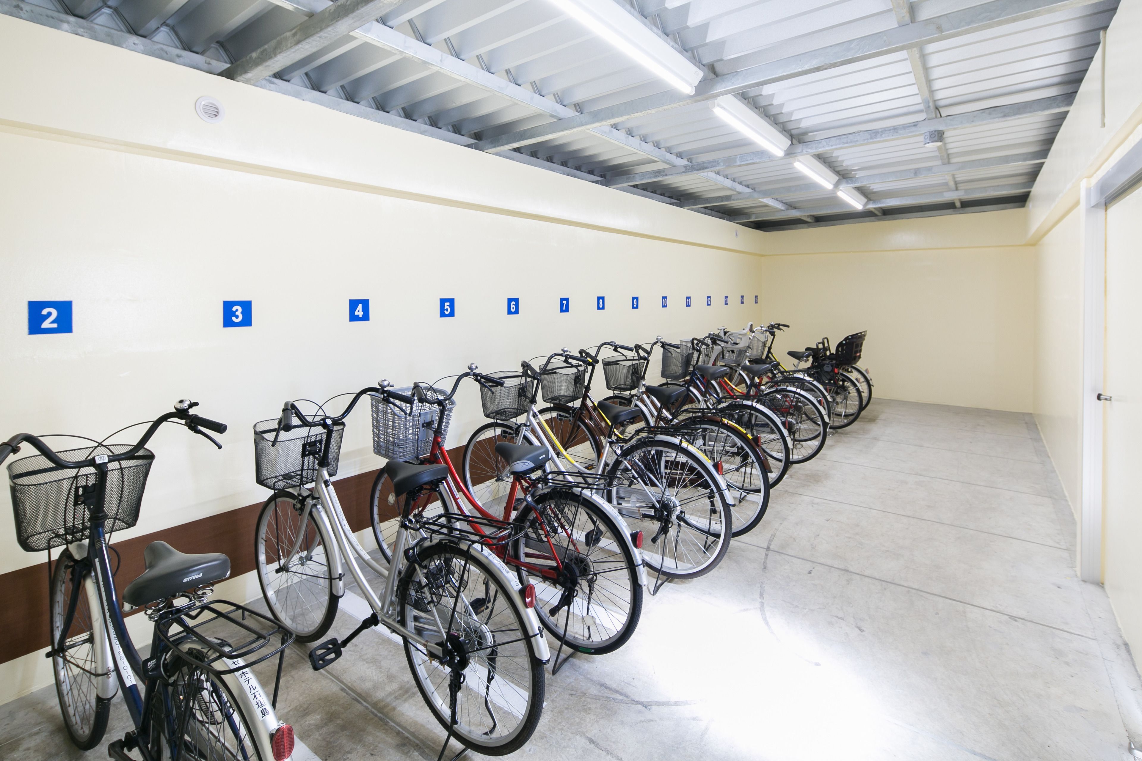 A bike rental station with bicycles numbered 2 to 10.