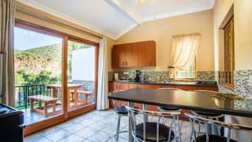Family Apartment | Private kitchen | Full-size fridge, coffee/tea maker, electric kettle, cleaning supplies