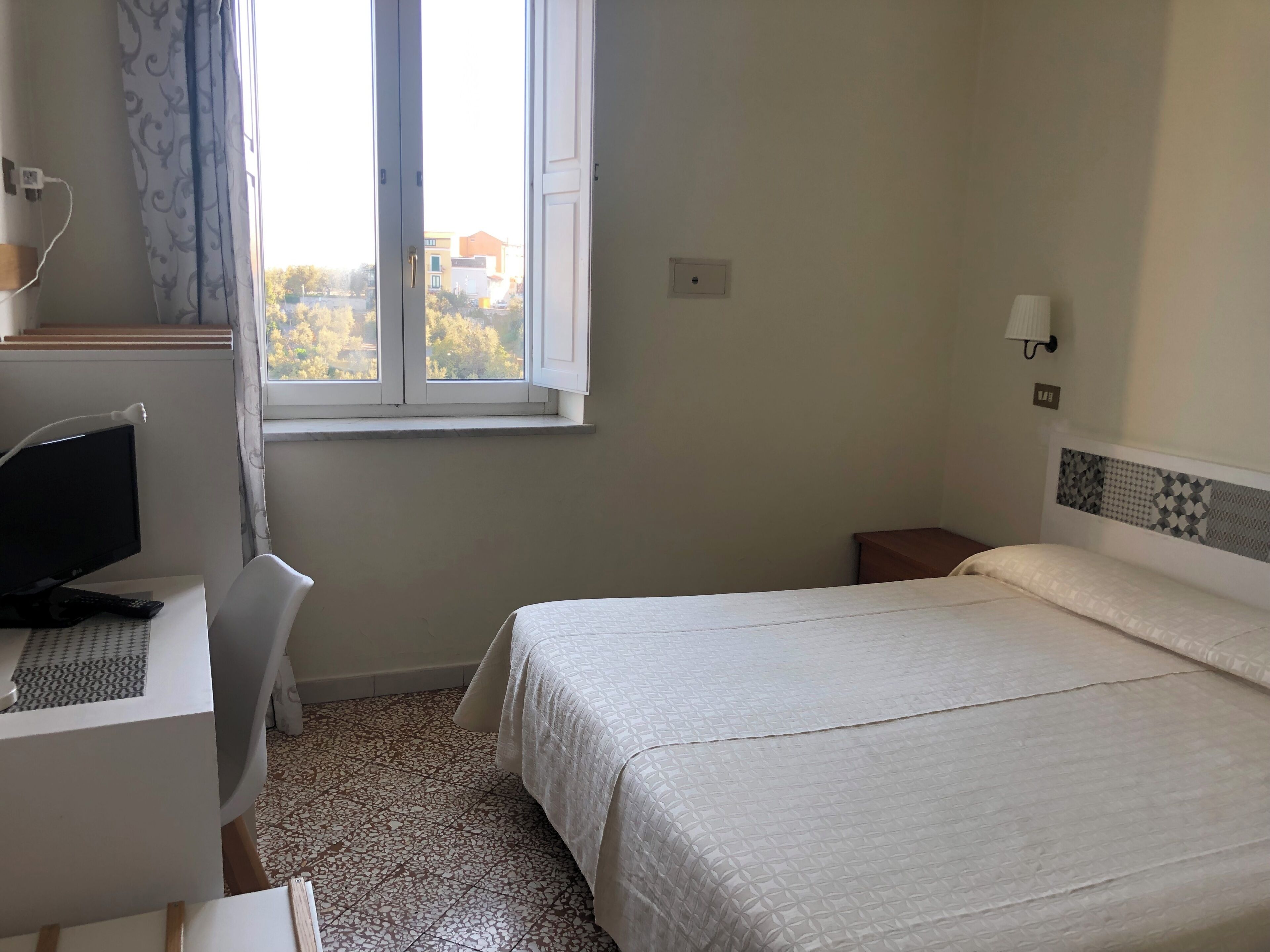 In-room safe, desk, laptop workspace, bed sheets