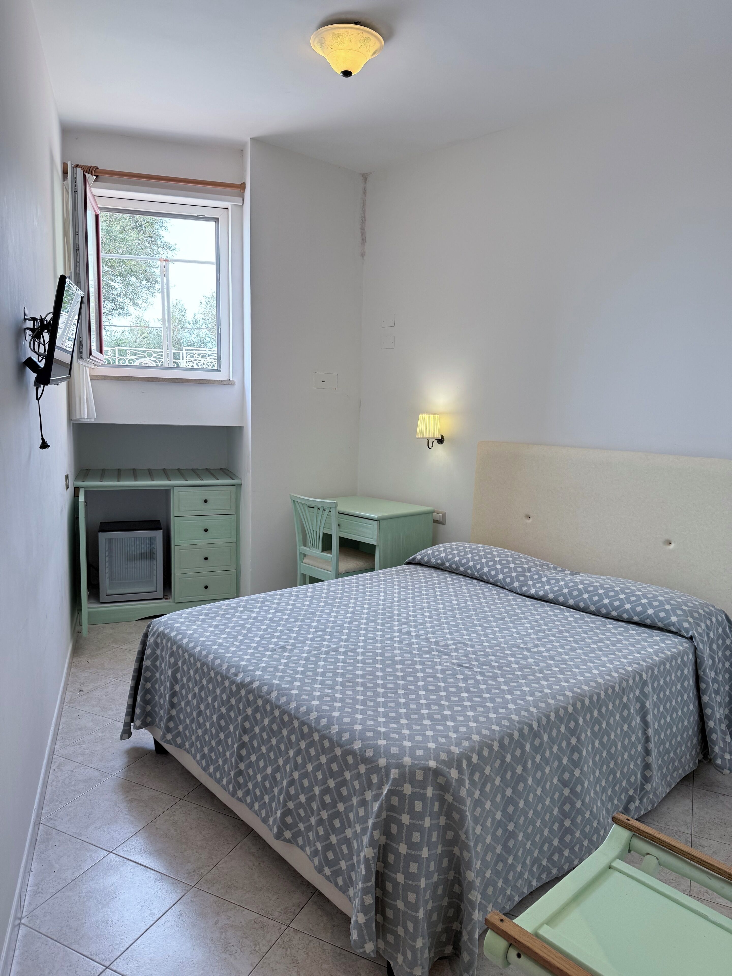 In-room safe, desk, laptop workspace, bed sheets