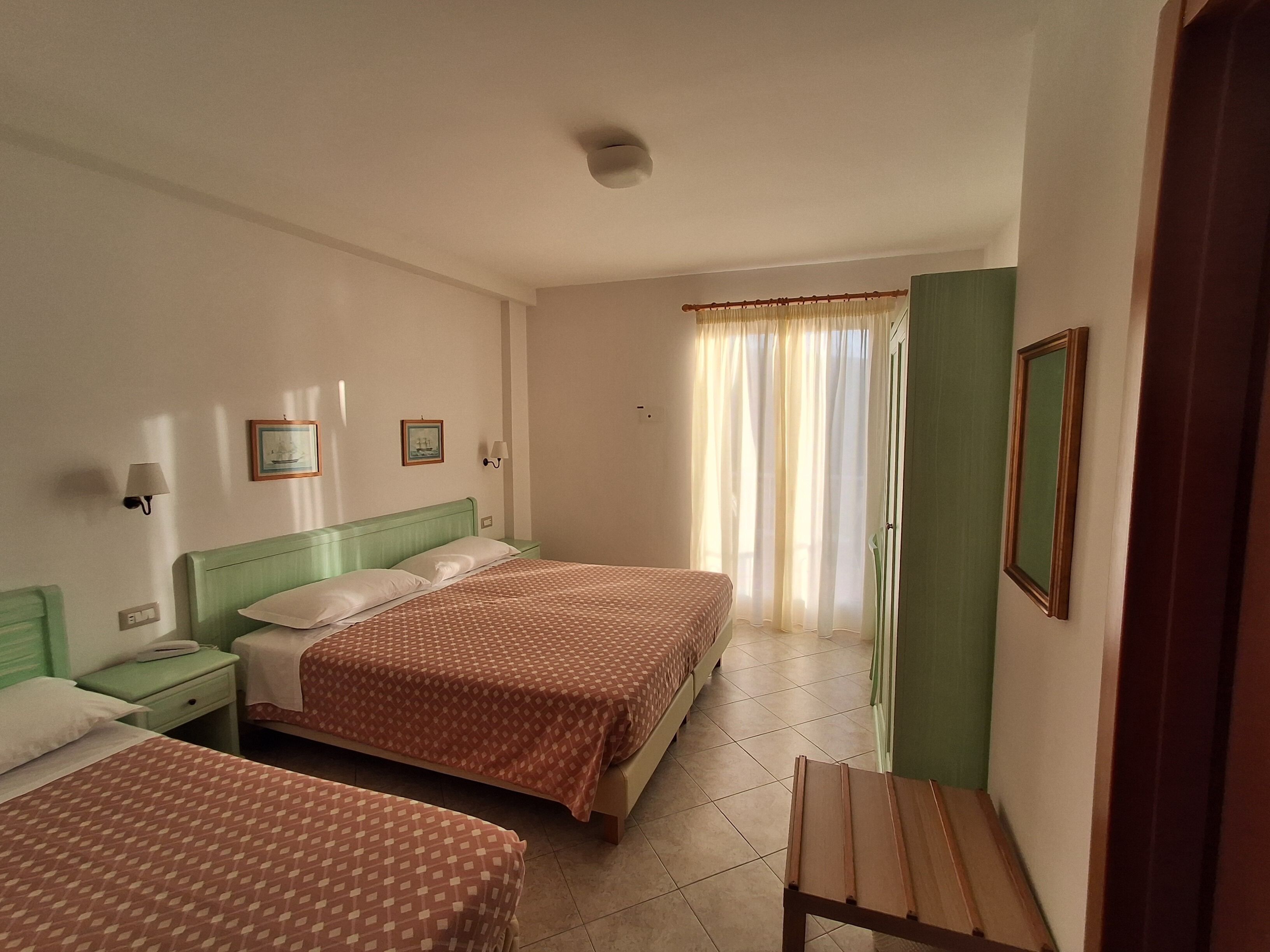 Classic Triple Room, Balcony | In-room safe, desk, laptop workspace, bed sheets