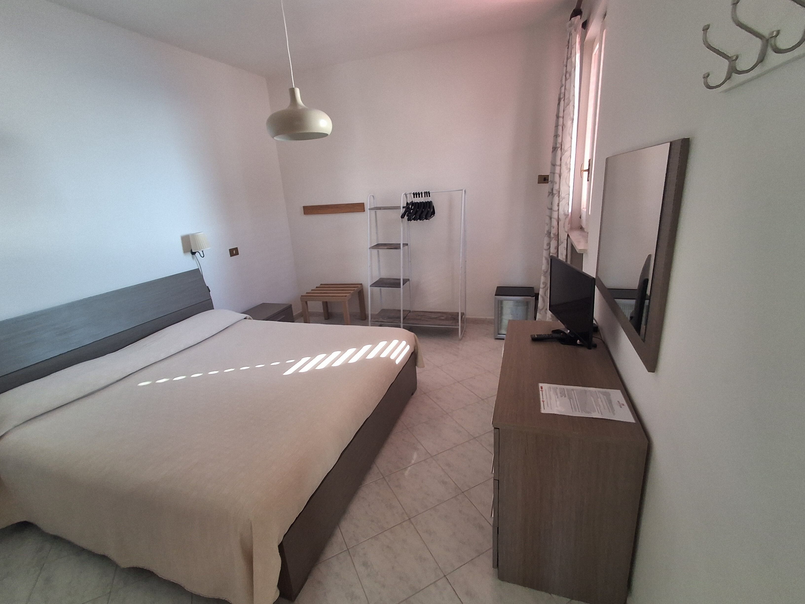 In-room safe, desk, laptop workspace, bed sheets