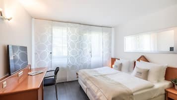 Hypoallergeen beddengoed, een bureau, verduisterende gordijnen