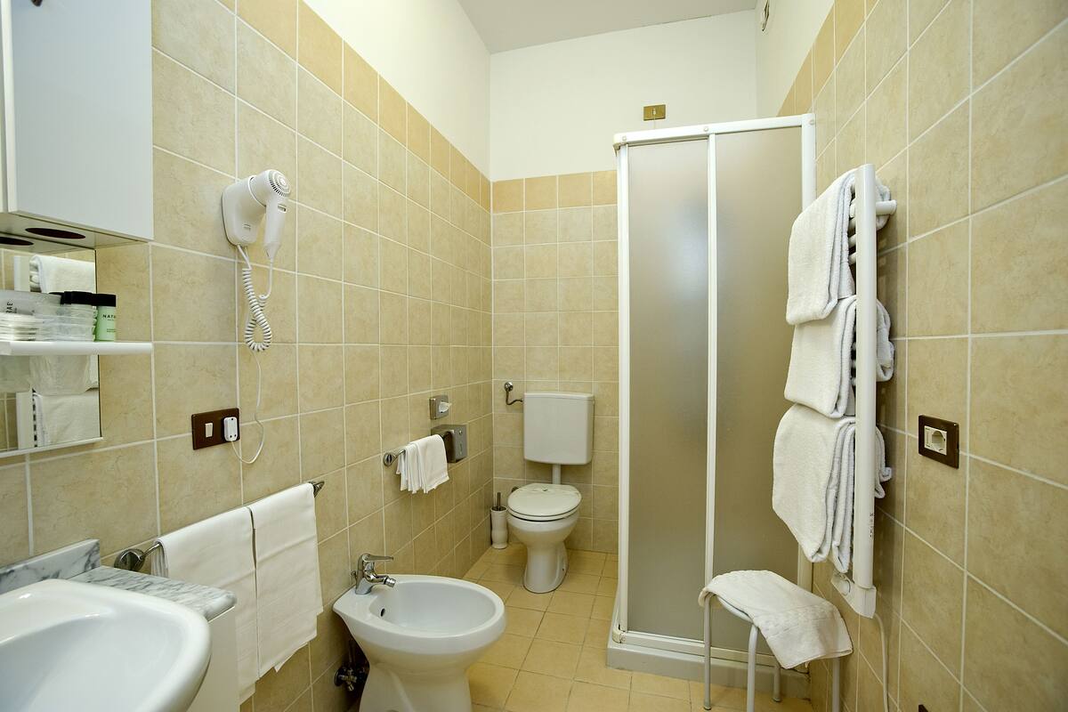 quadruple room | bathroom | shower, free toiletries, hair dryer, bidet