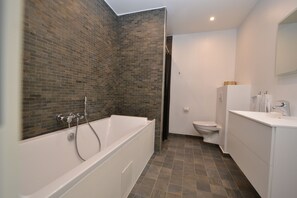 Exclusive Studio Suite | Bathroom | Designer toiletries, hair dryer, towels