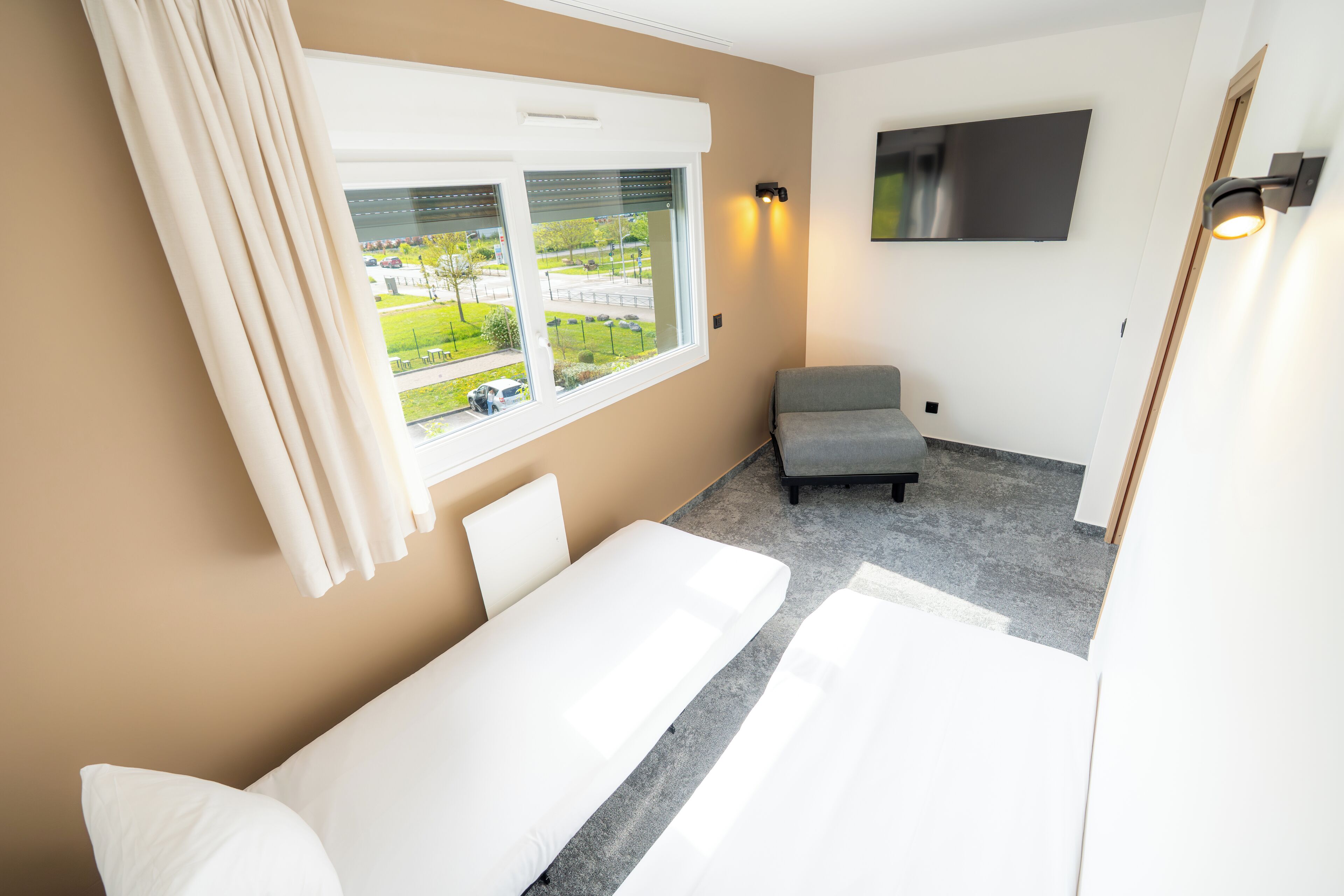 family room | premium bedding, individually furnished, desk, blackout curtains