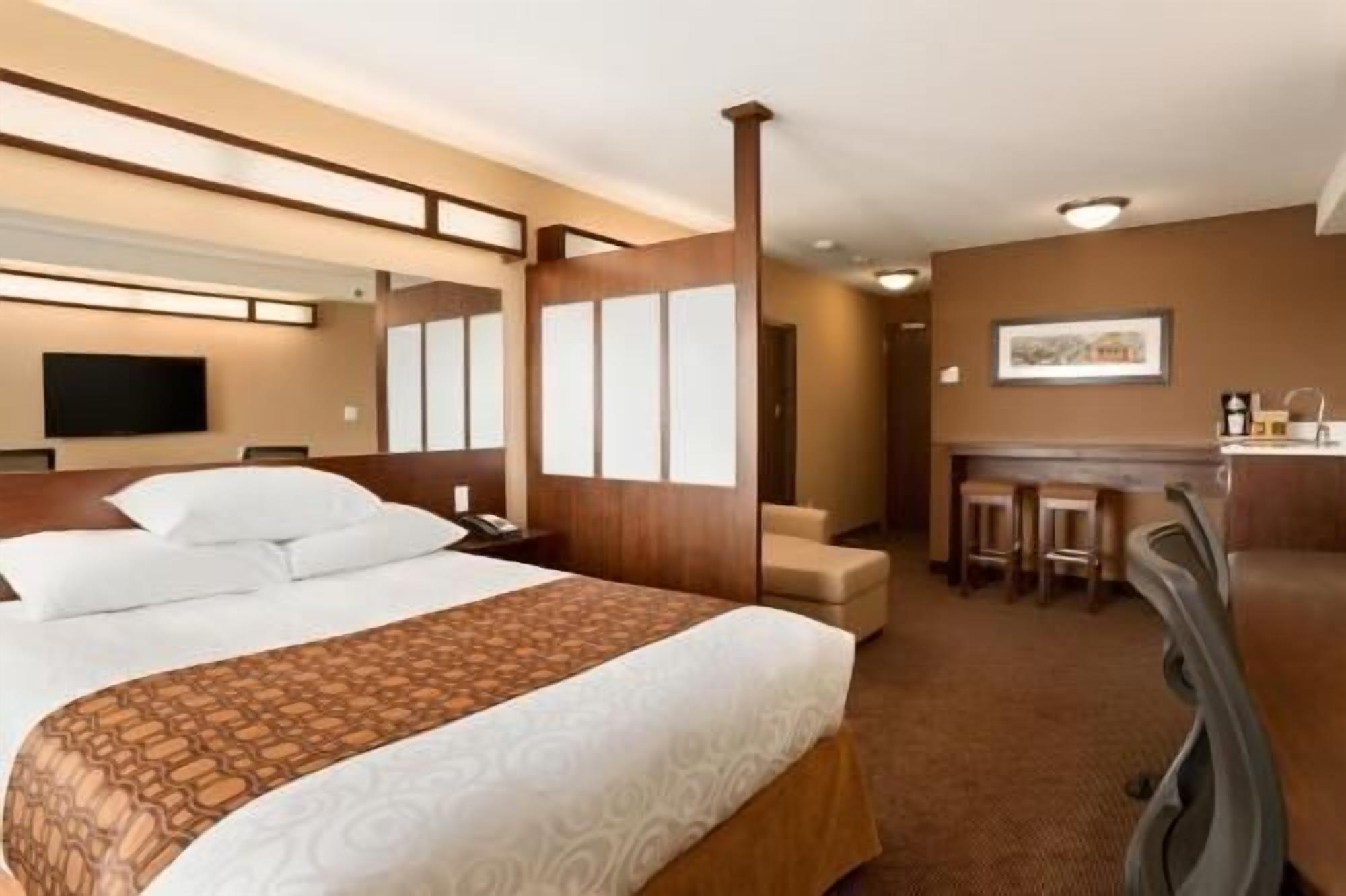 Premium bedding, desk, laptop workspace, blackout curtains