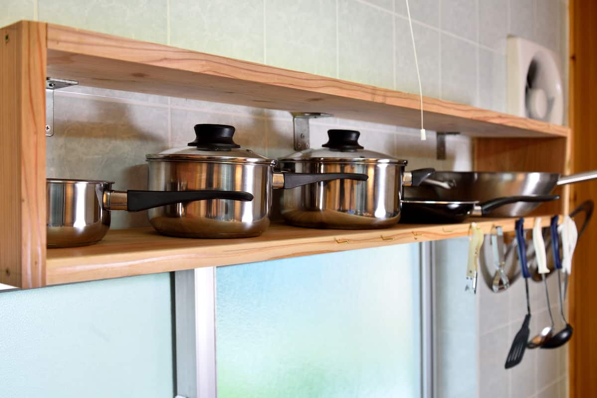 full-sized fridge, microwave, stovetop, cookware/dishes/utensils