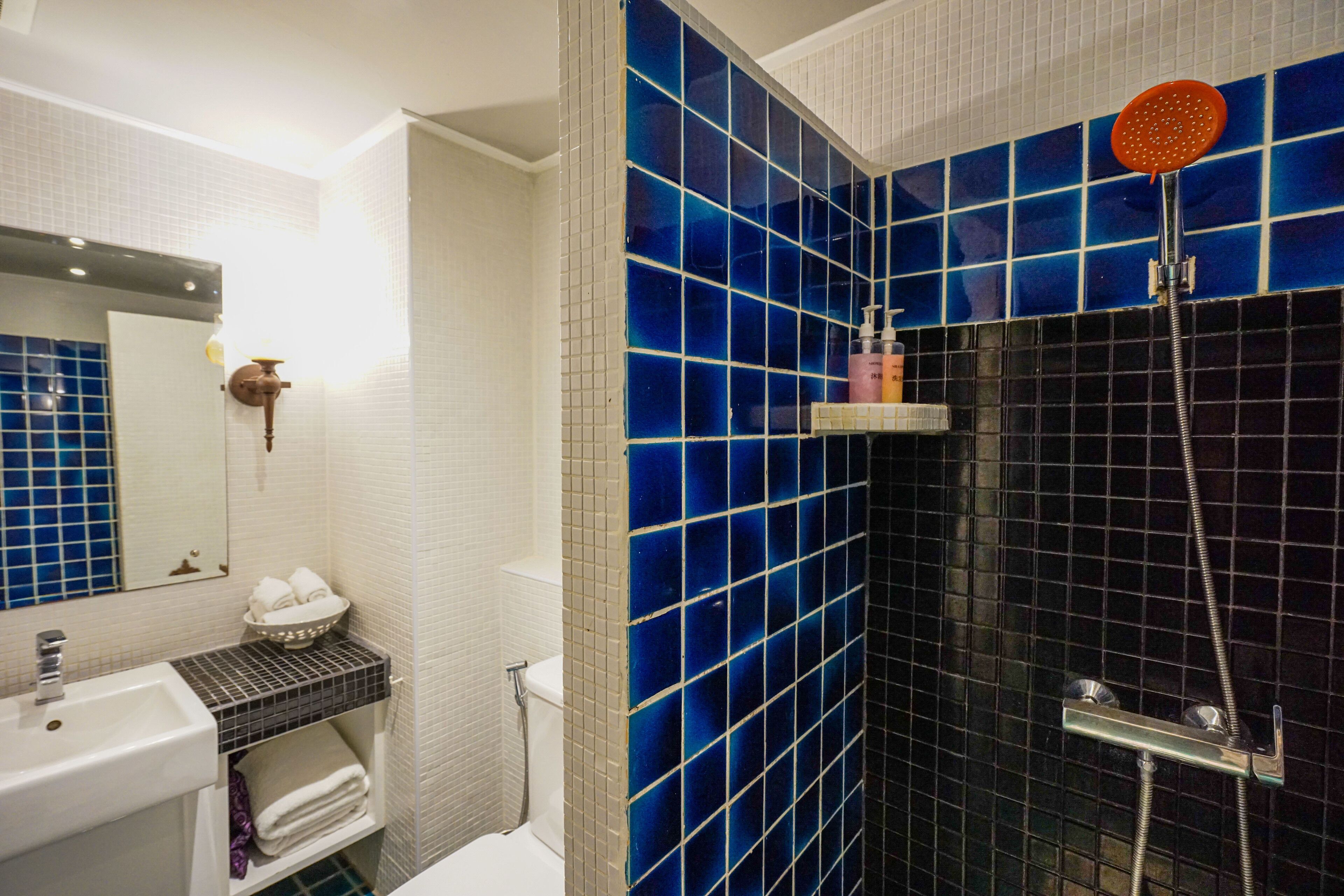 grand deluxe double room | bathroom | shower, free toiletries, hair dryer, bathrobes