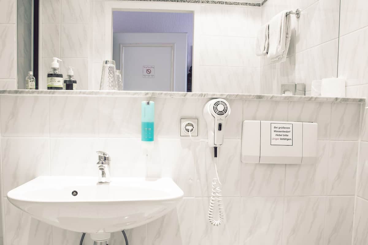 economy double room | bathroom | shower, designer toiletries, hair dryer, slippers