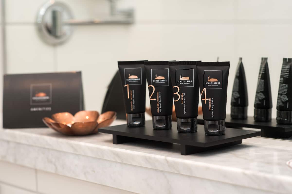 shower, designer toiletries, hair dryer, slippers