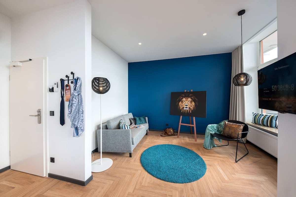 suite, 1 king bed, private bathroom | living area | 61-cm flat-screen tv with satellite channels, tv