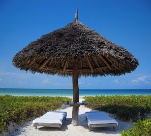 On the beach, free beach cabanas, sun-loungers, beach umbrellas