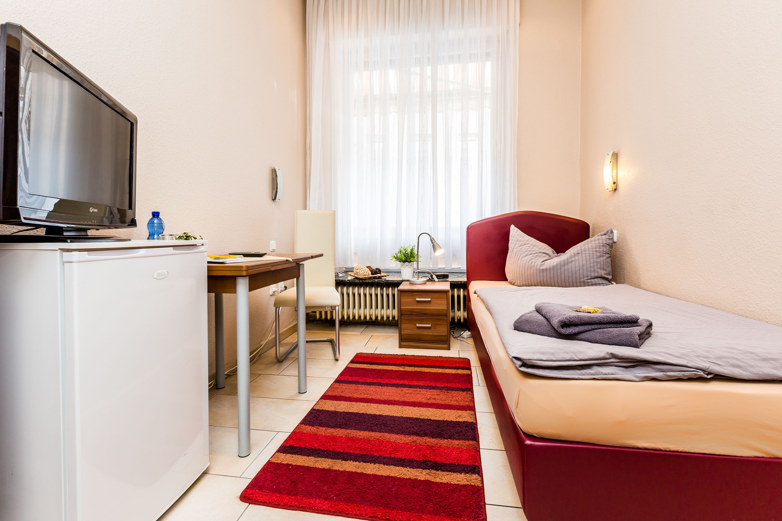 single room | in-room safe, iron/ironing board, rollaway beds, free wifi