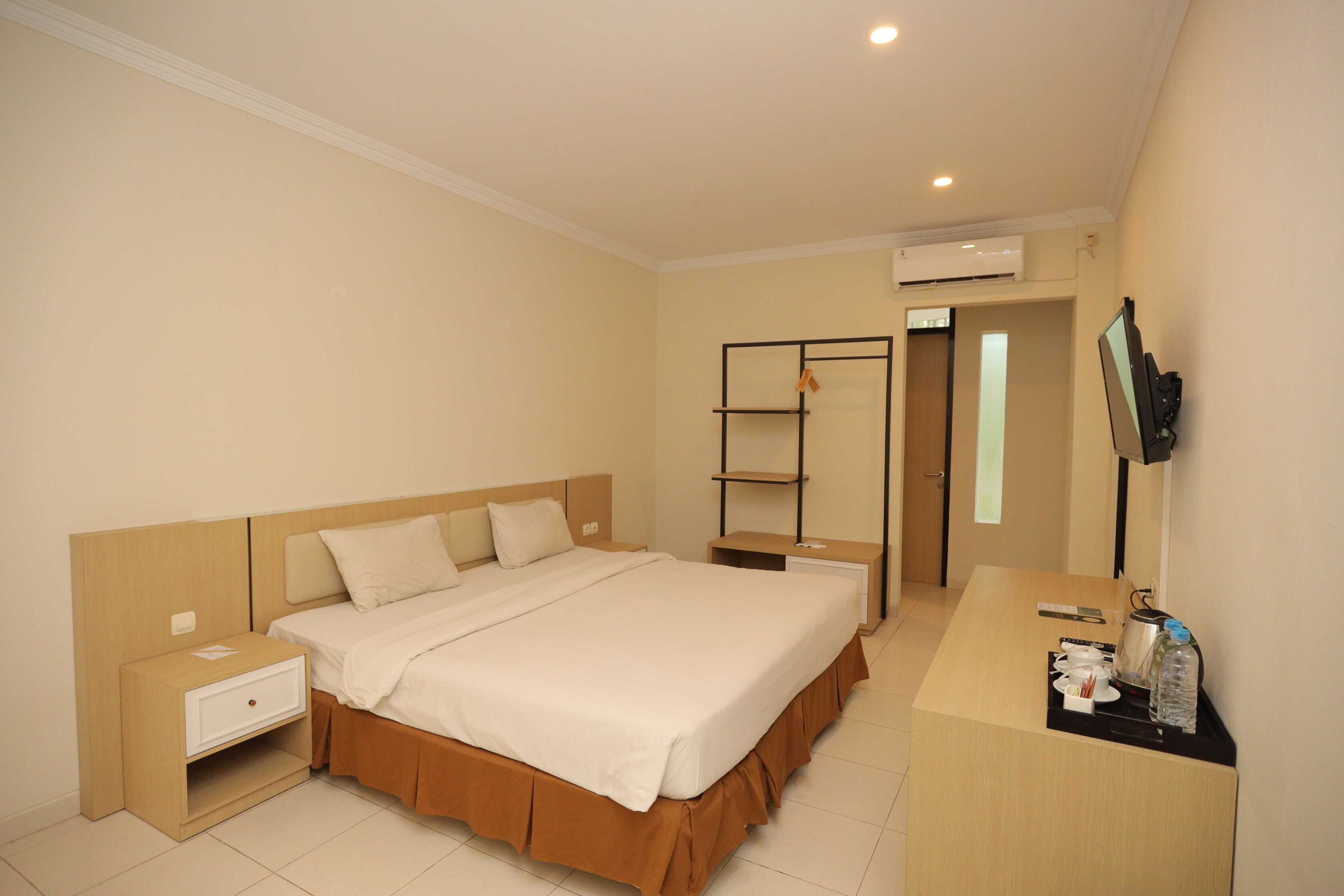 Habitación Deluxe | Ropa de cama de alta calidad, minibar, caja fuerte