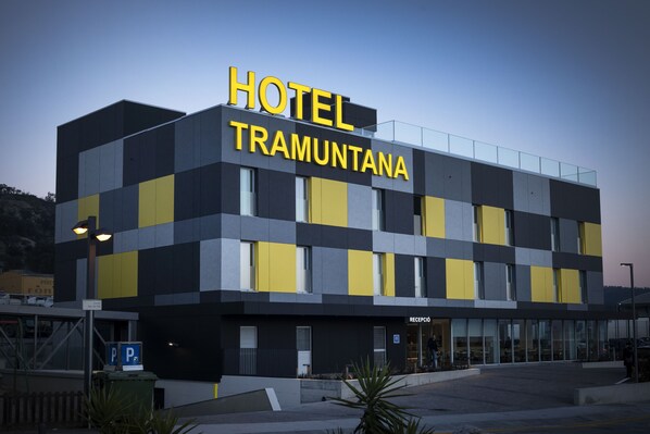 A modern hotel building with a checkered facade and a prominent 'HOTEL TRAMUNTANA' sign. - Hotel Tramuntana (La Jonquera)
