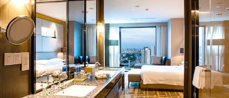Regency, Suite, 1 King Bed | Bathroom | Combined shower/tub, rainfall showerhead, hair dryer, bathrobes