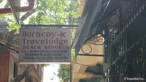 A sign for Boracay Travelodge Beach Resort Inc. with contact information. - Boracay Travelodge Beach Resort (Boracay Island)