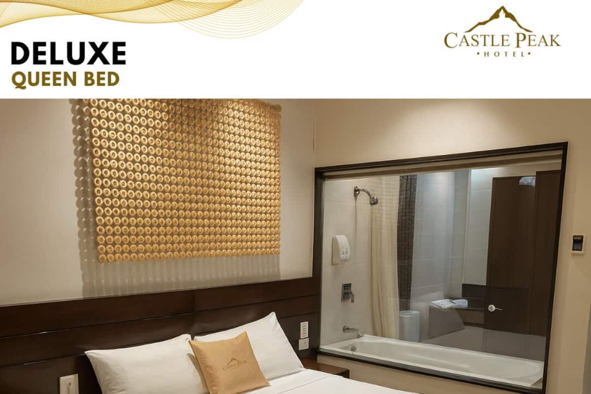 Habitación Deluxe | Minibar, caja de seguridad en la habitación y escritorio 