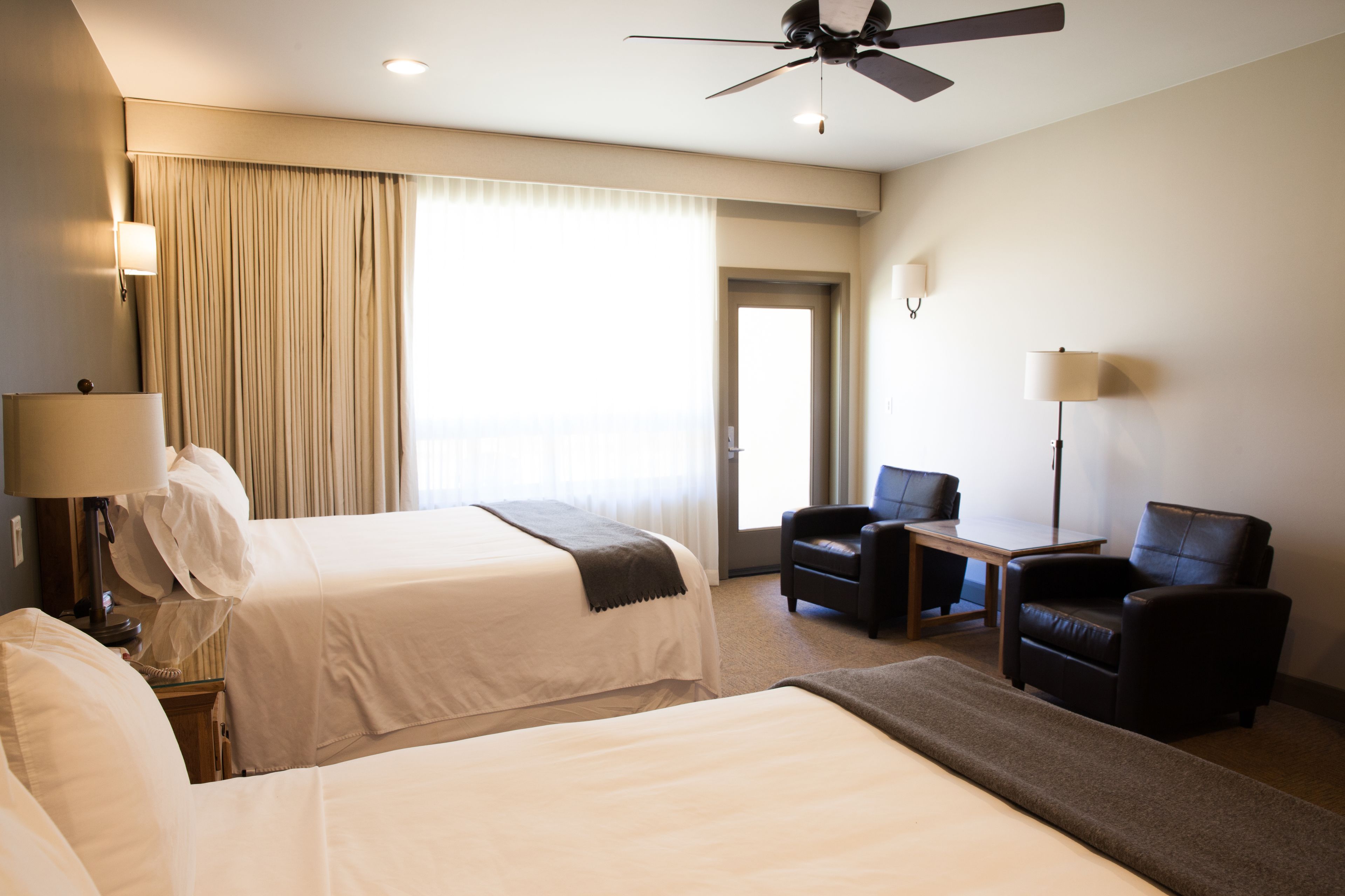 premium room, 2 queen beds, patio | living area | flat-screen tv