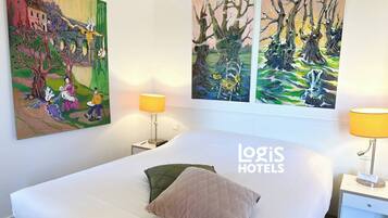 Premium bedding, desk, laptop workspace, soundproofing